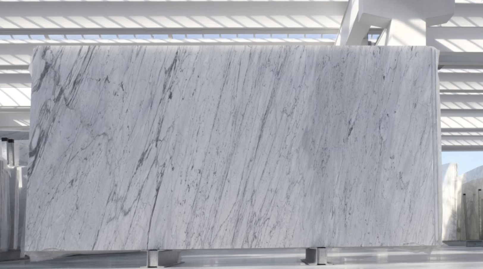 Bianco Carrara marble slab showing its characteristic fine gray veining