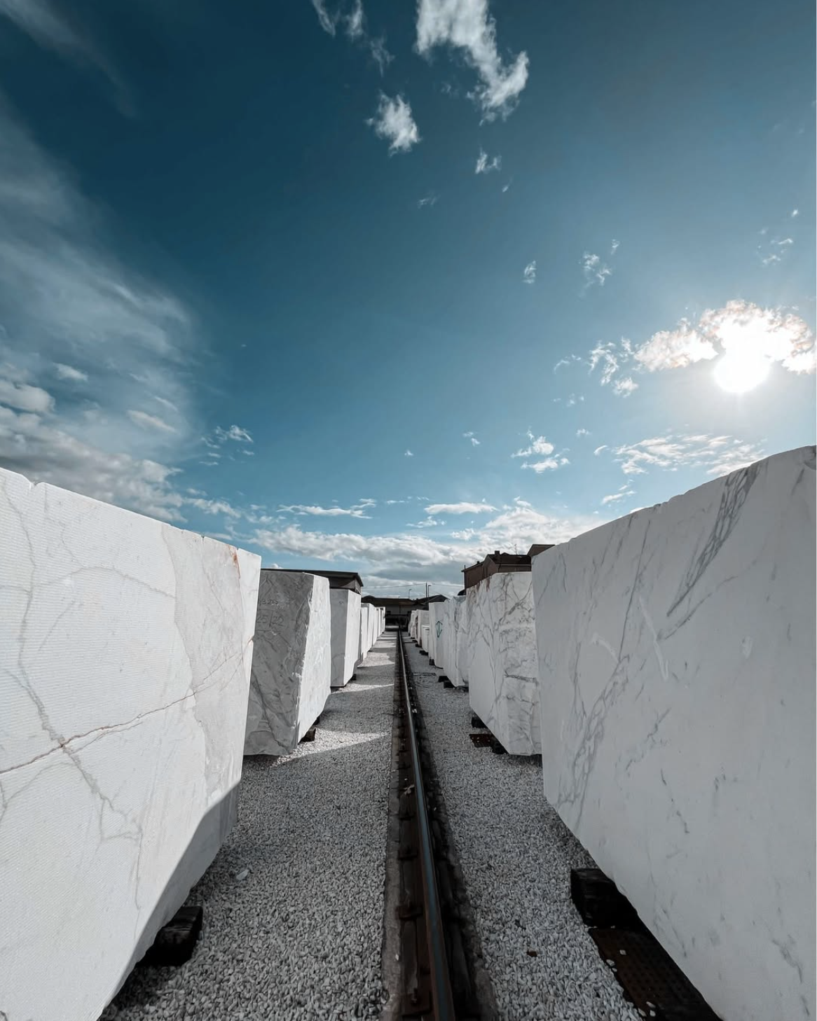 Rows of premium white marble blocks in a marble yard ready for direct distribution