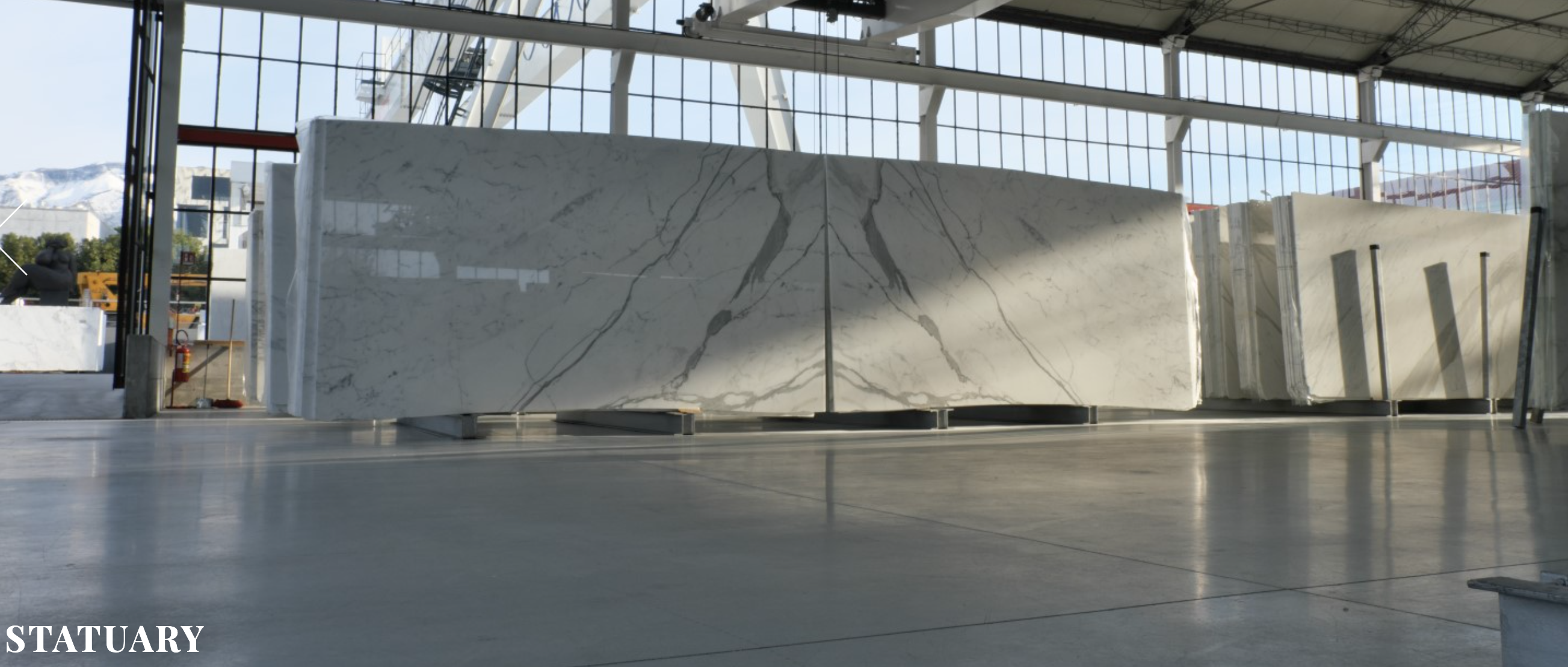 Large Statuario marble slab showing natural veining pattern